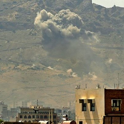 Smoke rises over a landscape as the Saudi-led coalition responds to recent Houthi military strikes.
