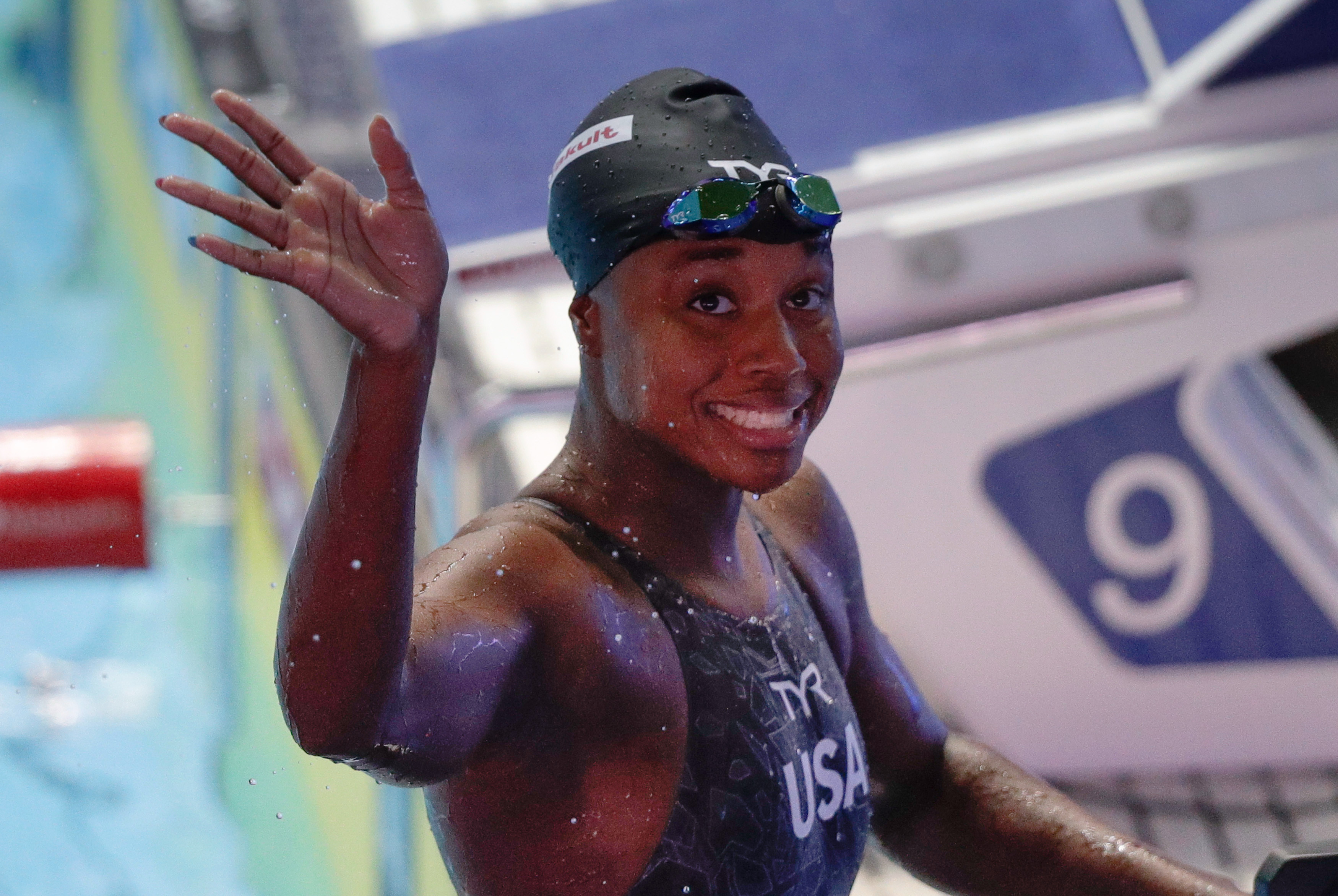 American swimmer Simone Manuel waves after winning the women's