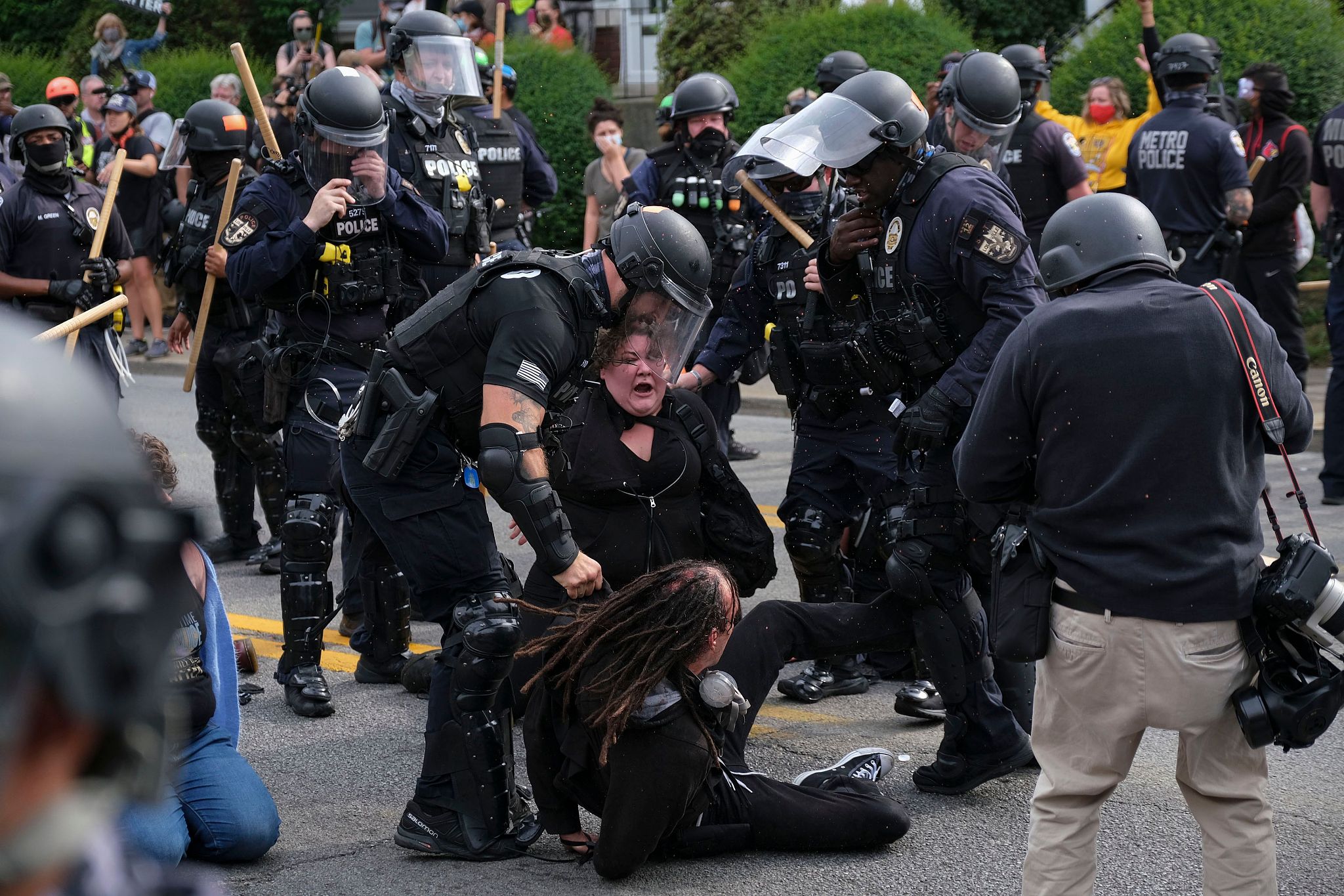 Protesters are arrested by police during a demonstration in Louisville, Ken...