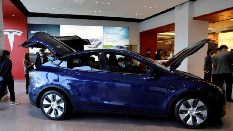Tesla shares surge on record electric car deliveries in first quarter ...