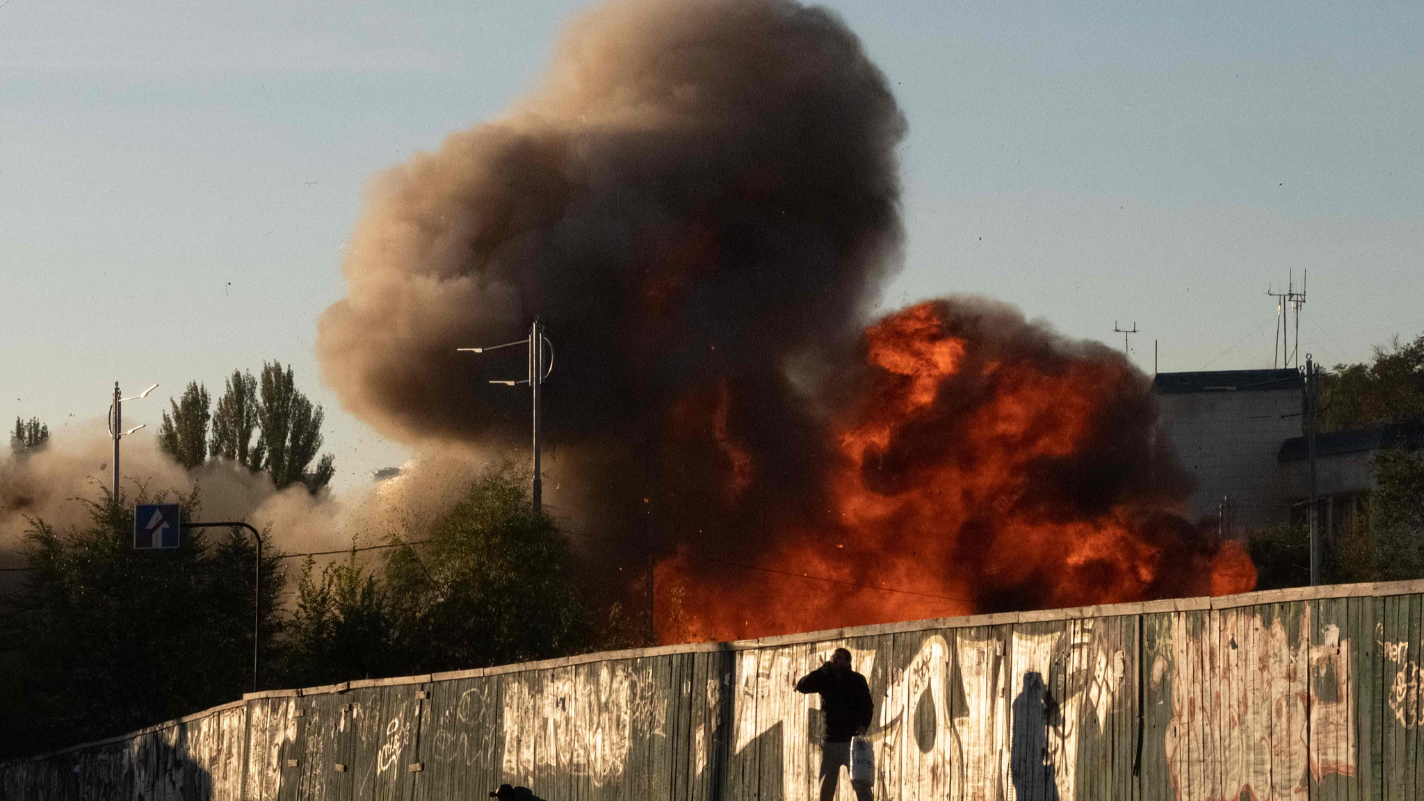 A man falls on the ground following a drone attack in Kyiv, Ukraine, October 17, 2022. /CFP