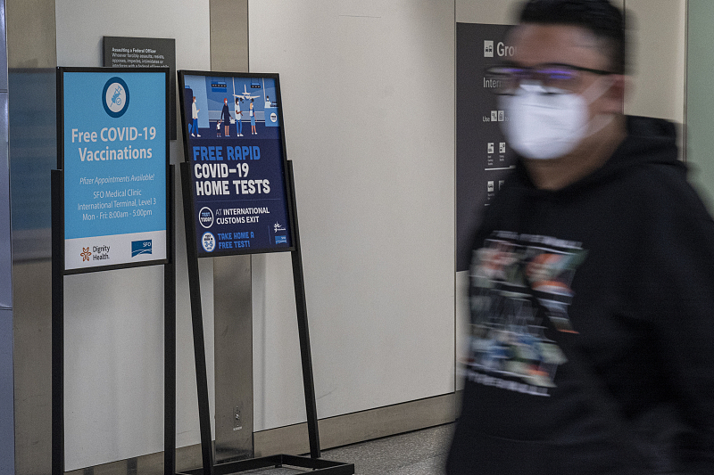 Signs for COVID-19 tests and vaccinations inside the arrivals hall at San Francisco International Airport (SFO) in San Francisco, California, U.S., June 13, 2022. /CFP