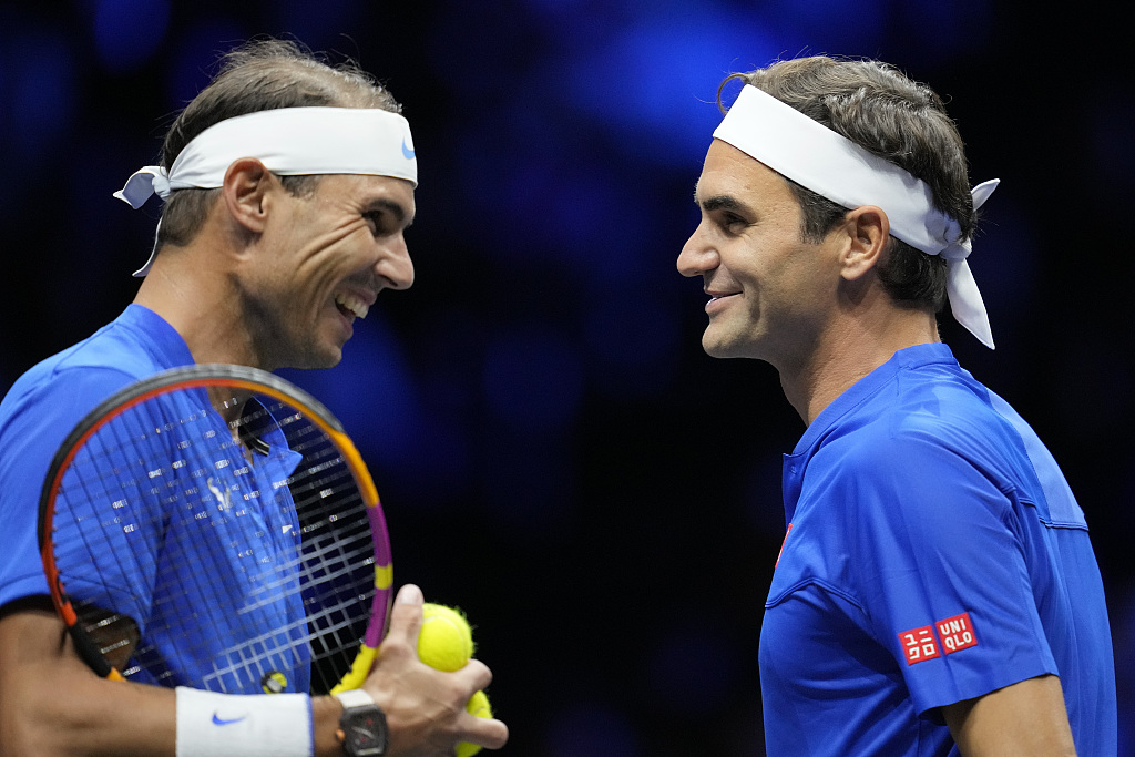 Team Europe's Rafael Nadal (L) and Roger Federer smile during their Laver Cup doubles match in London, September 23, 2022. Tennis great Federer retires after the event. /CFP