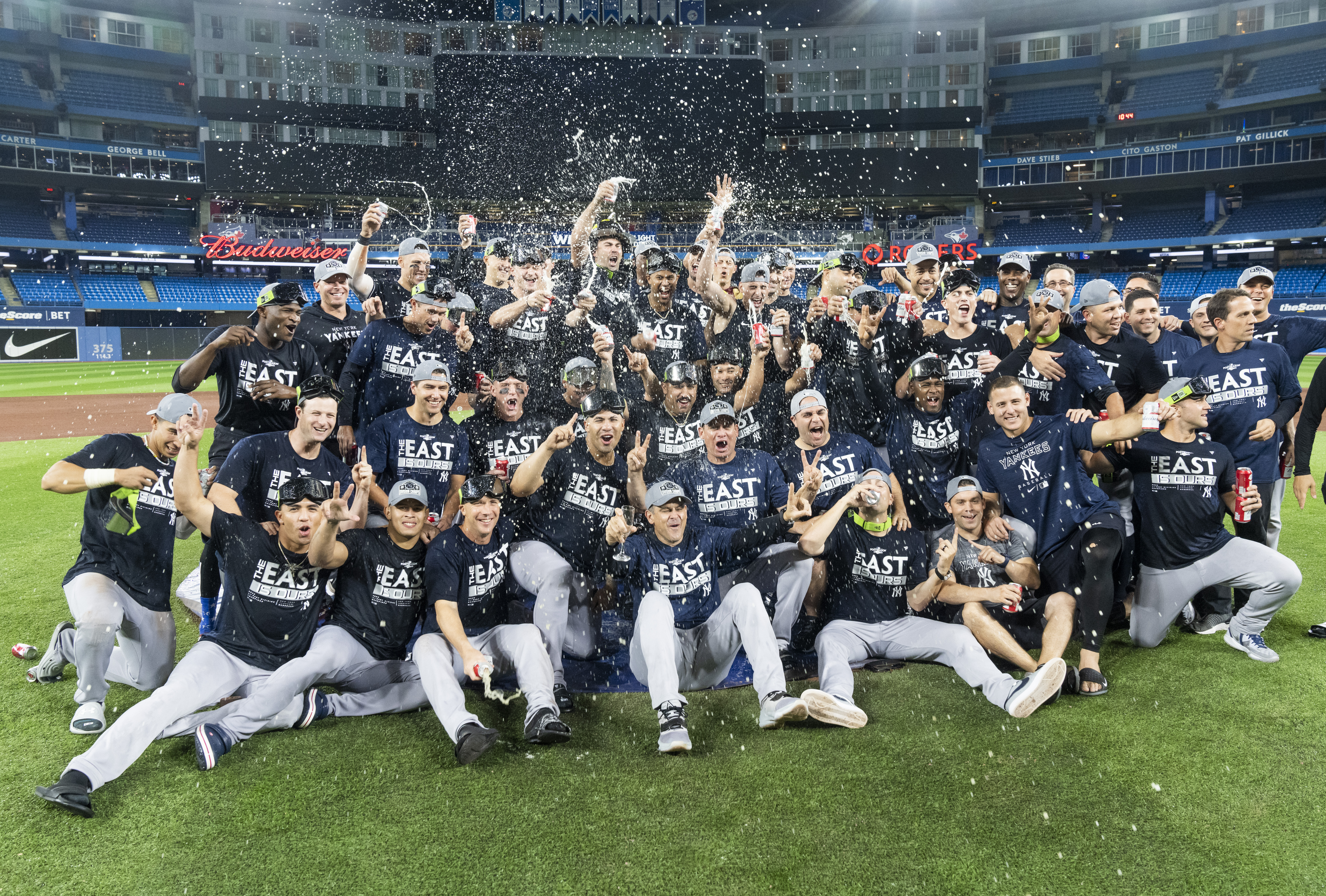 The New York Yankees celebrate winning the MLB American League East title after the 5-2 win over the Toronto Blue Jays at Rogers Centre in Toronto, Canada, September 27, 2022. /CFP