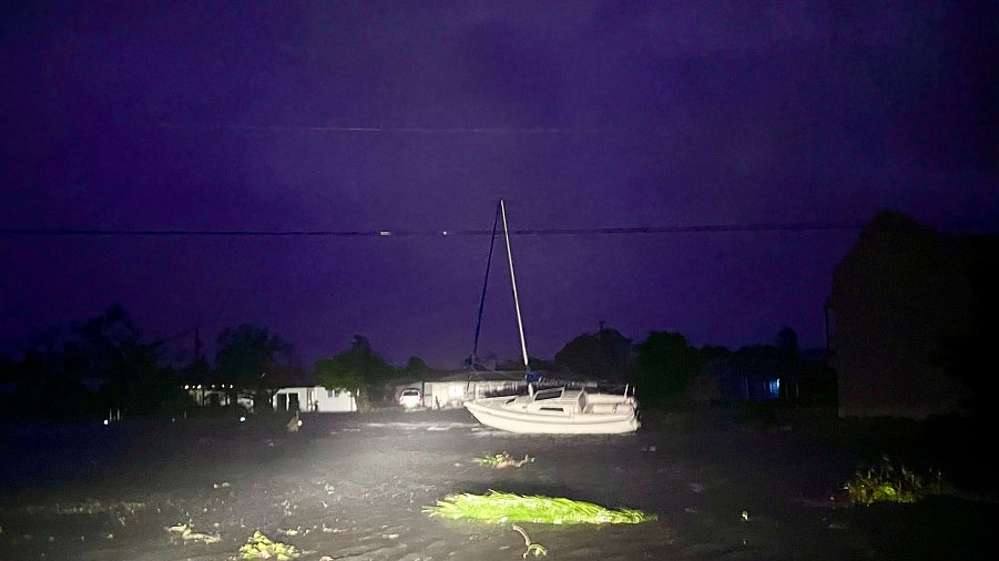 A displaced boat sits beside the roadway in the southeast corner of Cape Coral, Florida, U.S., September 28, 2022. /CFP