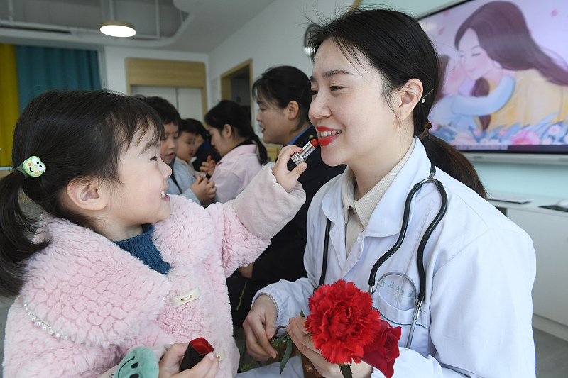 Activities are held for International Women's Day in Fuyang City, east China's Anhui Province, March 7, 2022. /CFP