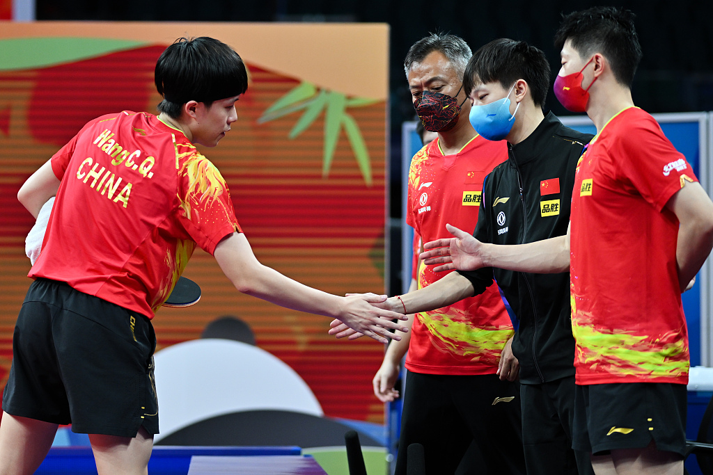 Members of the Chinese men's team celebrate during their opening matches with Puerto Rico in Chengdu, China, October 1, 2022. /CFP