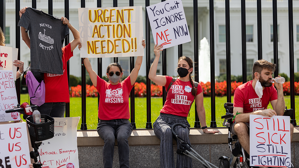 A group of protesters suffering from long-term COVID-19 symptoms demonstrate outside of the White House, calling out U.S. President Joe Biden for his remarks on CBS's 