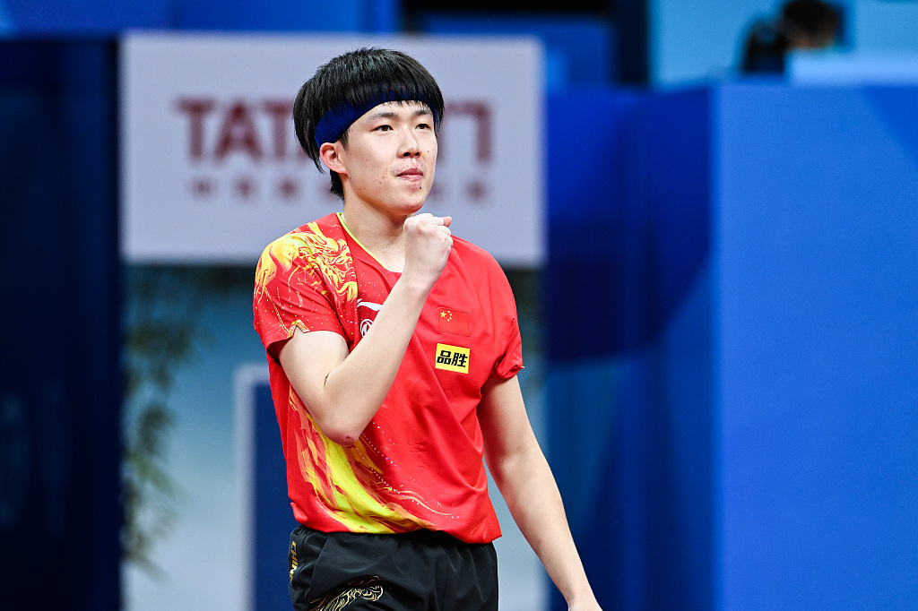 Wang Chuqin of China celebrates his victory during the match, October 3, 2022. /CFP