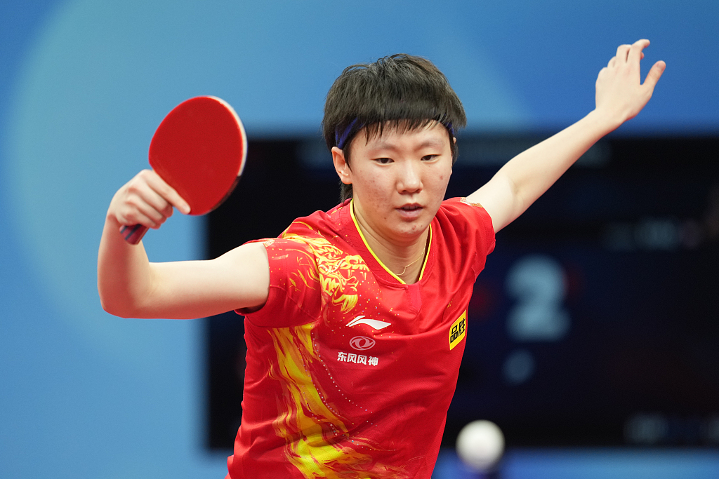 Manyu Wang of China competes against Adriana Diaz of Puerto Rico at the World Team Table Tennis Championships Finals in Chengdu, China, October 2, 2022. /CFP