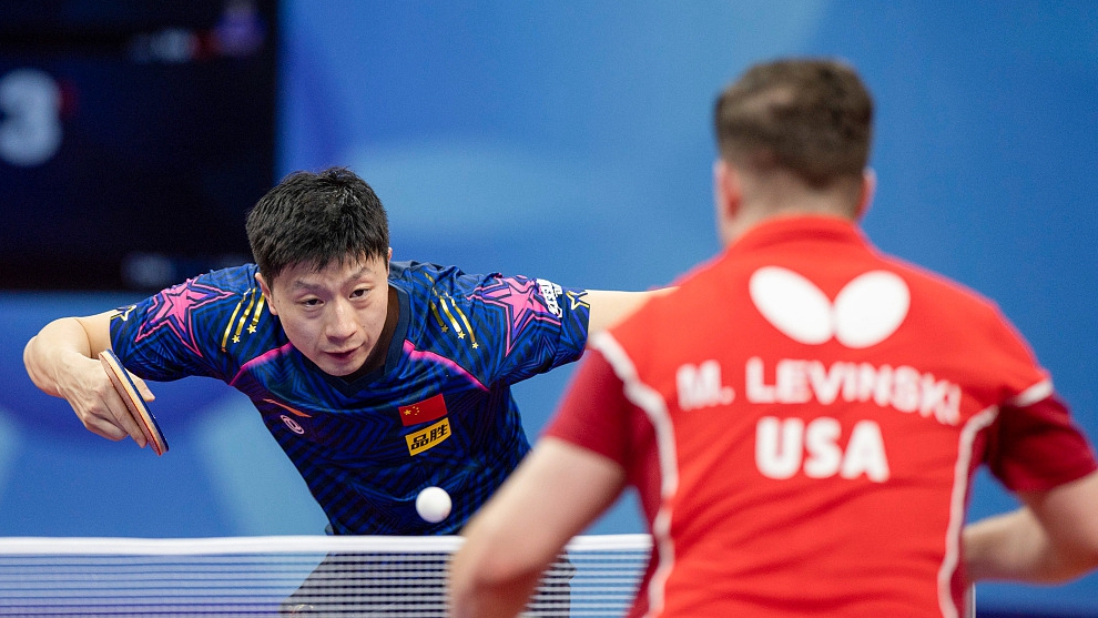 China's Ma Long (L) hits a return during his clash with Mishel Levinski of the United States at the World Team Table Tennis Championships Finals in Chengdu, China, October 2, 2022. /CFP
