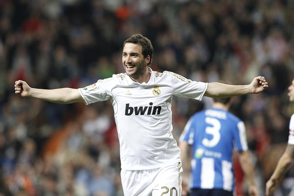 Gonzalo Higuain of Real Madrid celebrates after scoring a goal in the La Liga game against Real Sociedad at Estadio Santiago Bernabeu in Madrid, Spain, March 24, 2012. /CFP