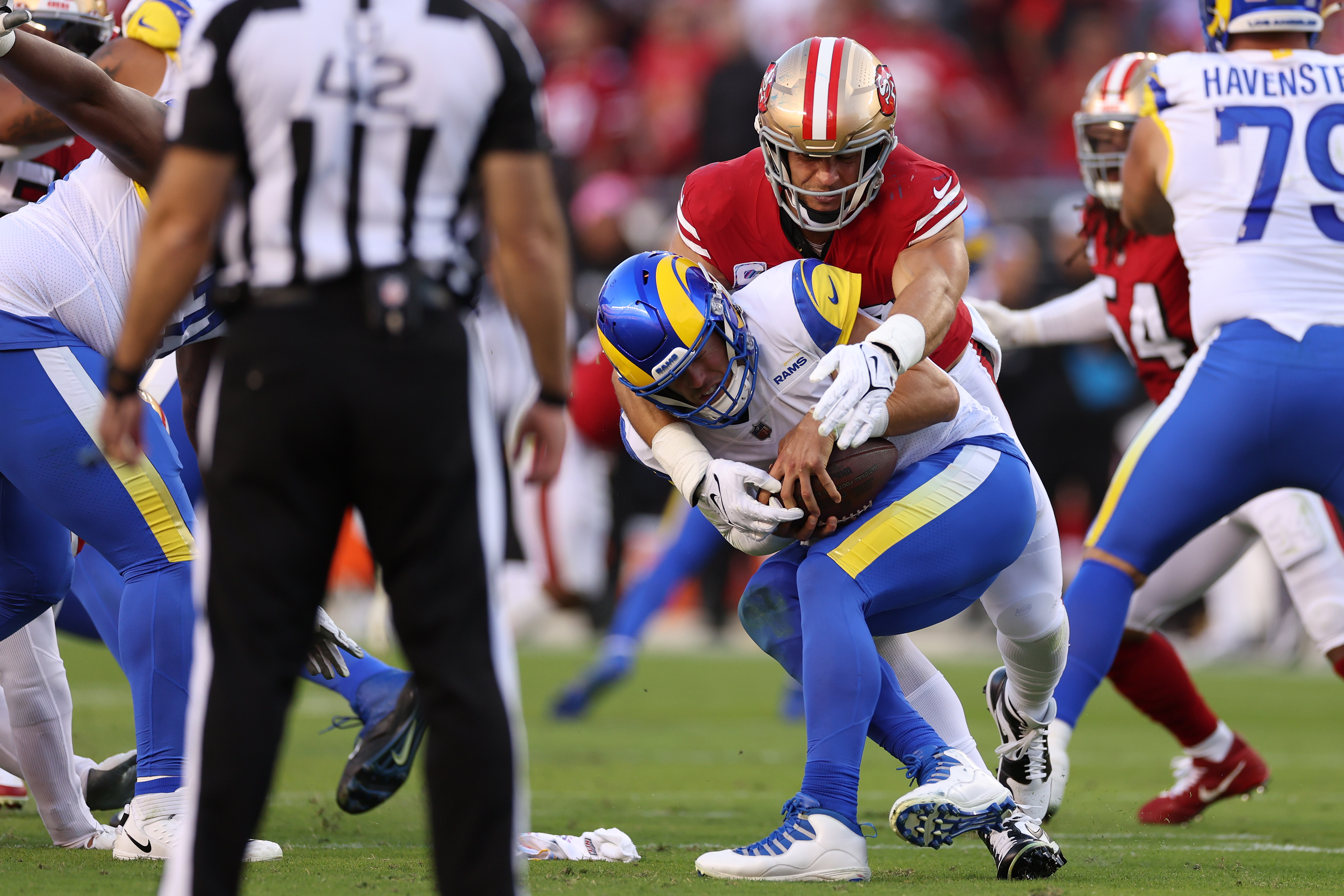 Quarterback Matthew Stafford (C) of the Los Angeles Rams is sacked by defensive end Nick Bosa of the San Francisco 49ers in the game at Levi's Stadium in Santa Clara, California, October 3, 2022. /CFP