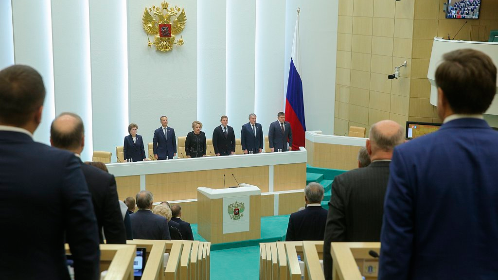 In this photo provided by The Federation Council of The Federal Assembly of The Russian Federation Press Service, lawmakers of Federation Council of the Federal Assembly of the Russian Federation listen to the national anthem while attending a session in Moscow, Russia, October 4, 2022. /CFP