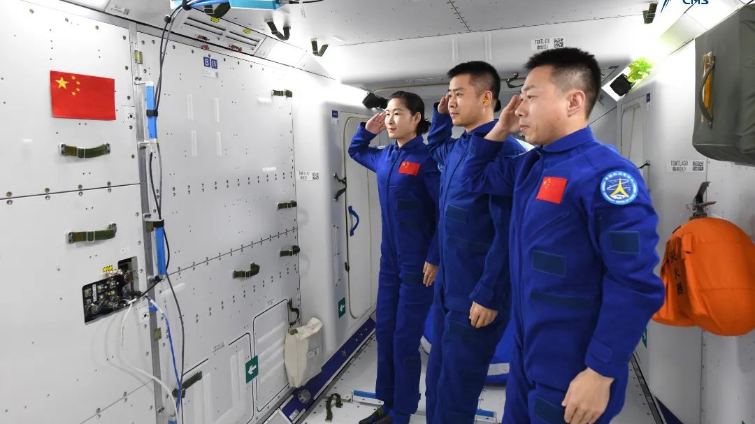 The Shenzhou-14 taikonauts, currently in China's space station for a six-month mission, salute the national flag. /CMSA