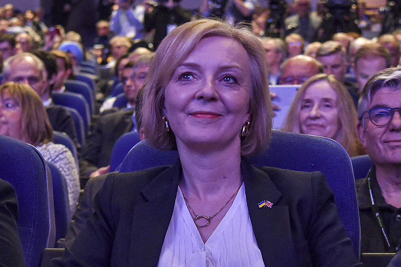 Britain's Prime Minister Liz Truss listens to Britain's Chancellor of the Exchequer Kwasi Kwarteng speaking at Conservative Party conference at ICC in Birmingham, England, Oct. 3, 2022. /CFP