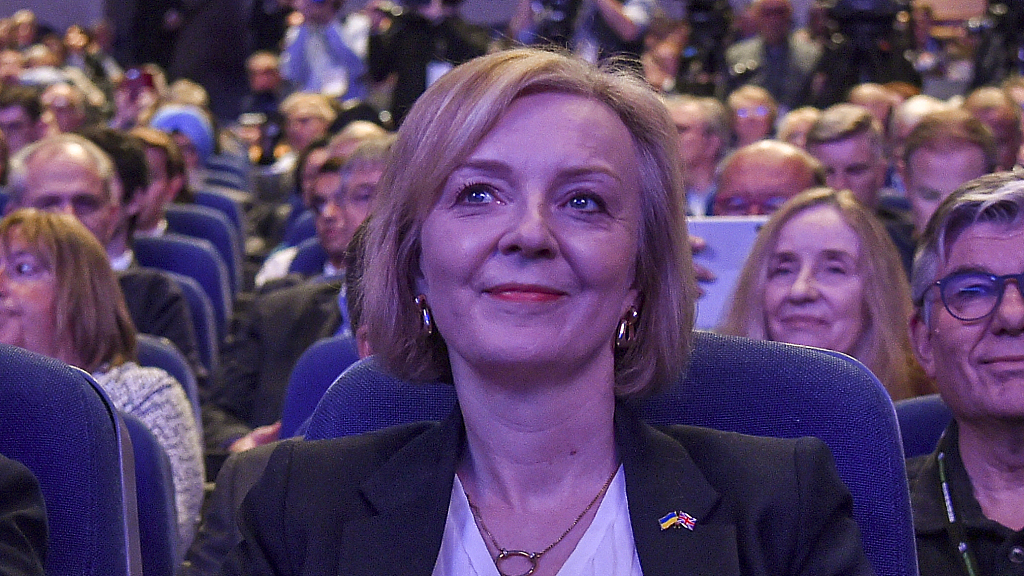 Britain's Prime Minister Liz Truss listens to Britain's Chancellor of the Exchequer Kwasi Kwarteng speaking at the Conservative Party conference at the ICC in Birmingham, England, October 3, 2022. /CFP