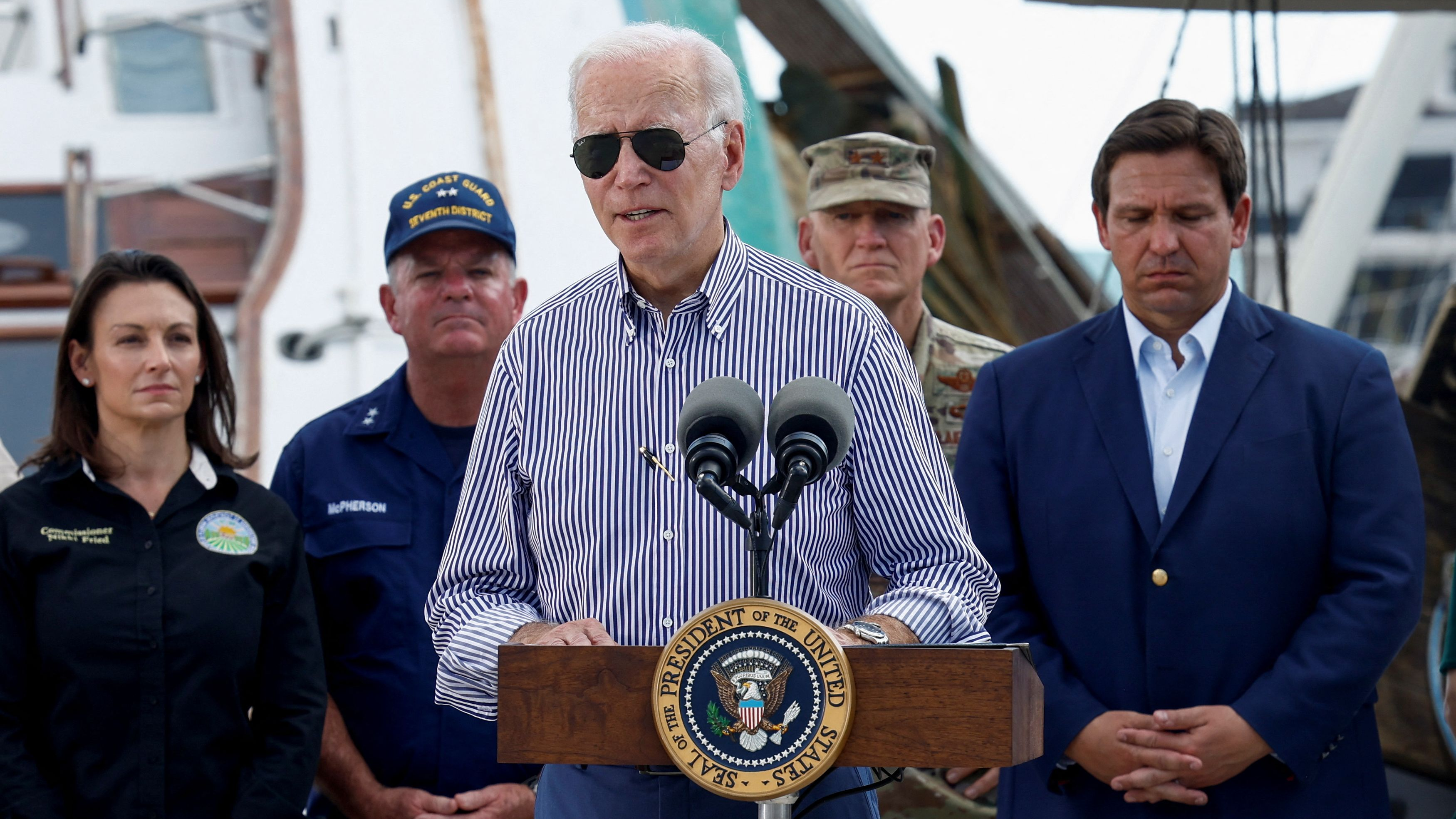 U.S. President Joe Biden (C) speaks about the destruction caused by Hurricane Ian and relief efforts as he visits Fisherman's Wharf while touring hurricane-damaged areas, in Fort Myers Beach, Florida, U.S., October 5, 2022. /Reuters