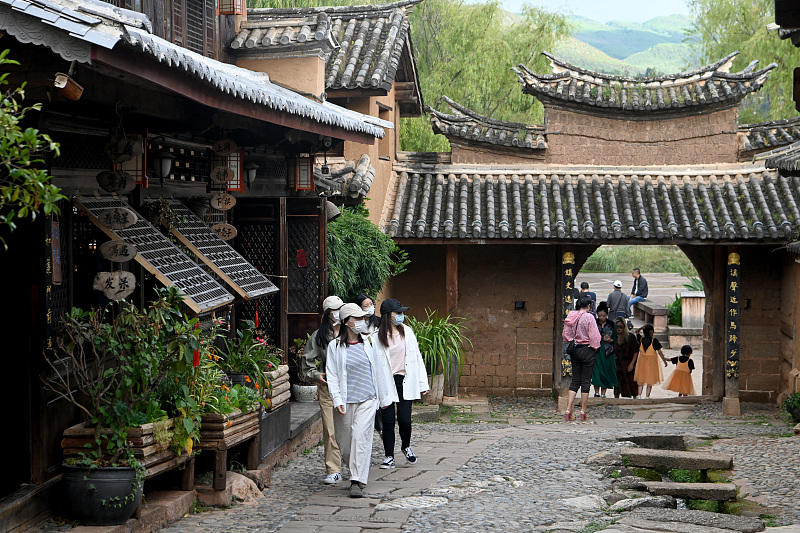 Tourists visit the ancient town of Shaxi in Dali, southwest China's Yunnan Province, October 4, 2022. /CFP