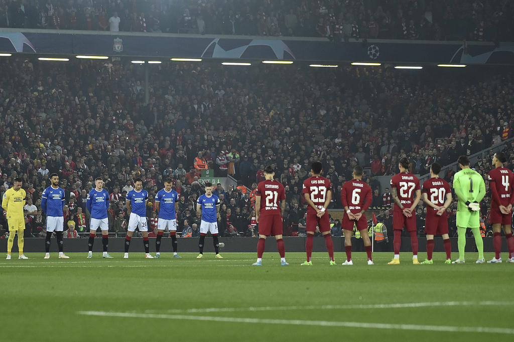 Players observe a minute of silence in memory of the victims of a stampede during a football match in Indonesia before the UEFA Champions League group match between Liverpool and Rangers at Anfield in Liverpool, England, October 4, 2022. /CFP