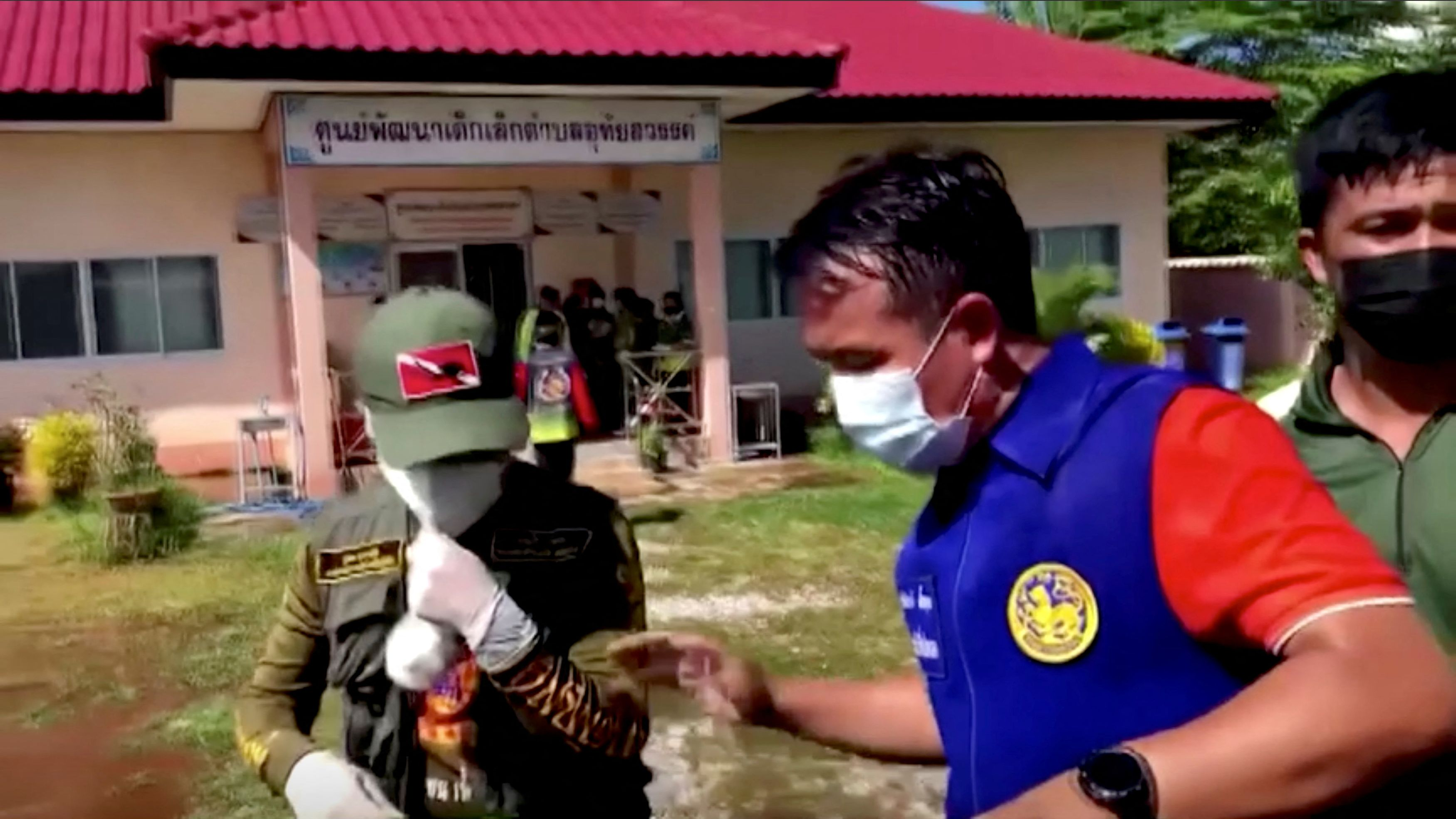 Officials and authorities guard the gate of a daycare center after a mass shooting in Uthai Sawan, Nong Bua Lamphu Province, Thailand, October 6, 2022. /Reuters