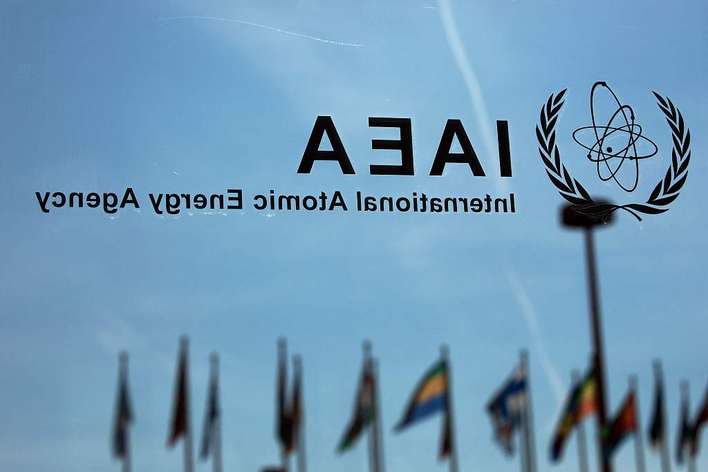 The logo of the International Atomic Energy Agency (IAEA) is seen on the back of a glass door in the IAEA building in Vienna, Austria, September 13, 2021. /CFP