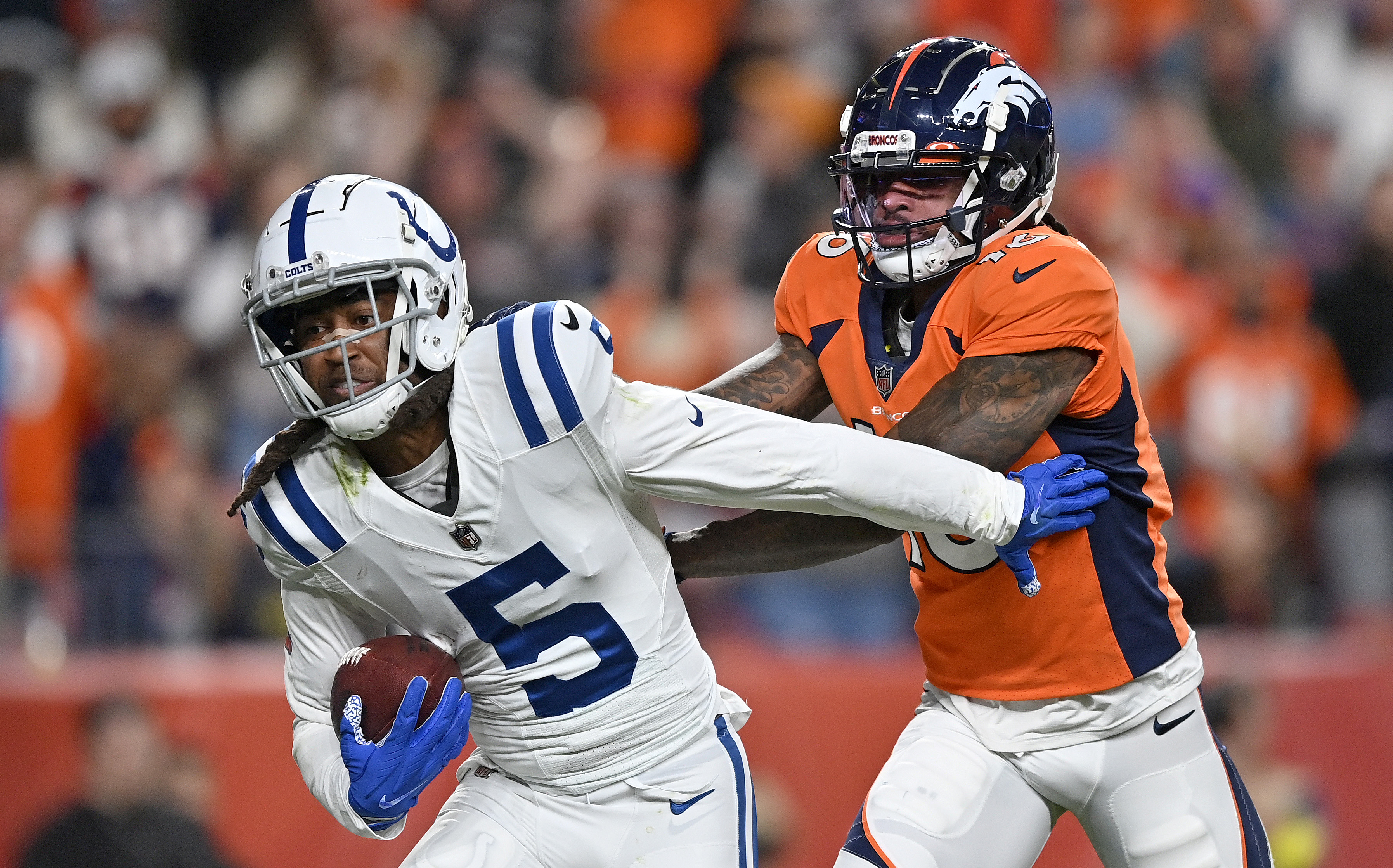 Cornerback Stephon Gilmore (#5) of the Indianapolis Colts intercepts a pass by quarterback Russell Wilson of the Denver Broncos in the game at Empower Field at Mile High in Denver, Colorado, October 6, 2022. /CFP