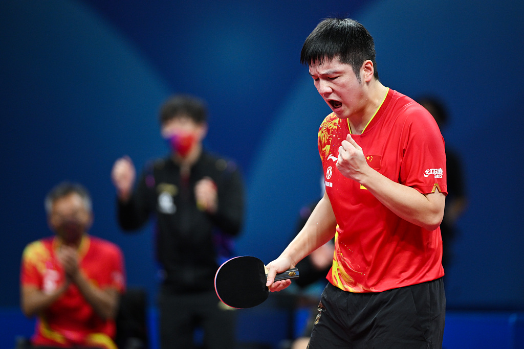 Fan Zhendong of China reacts after scoring in the World Team Table Tennis Championships Men's semifinals against Japan in Chengdu, southwest China's Sichuan Province, October 8, 2022. /CFP