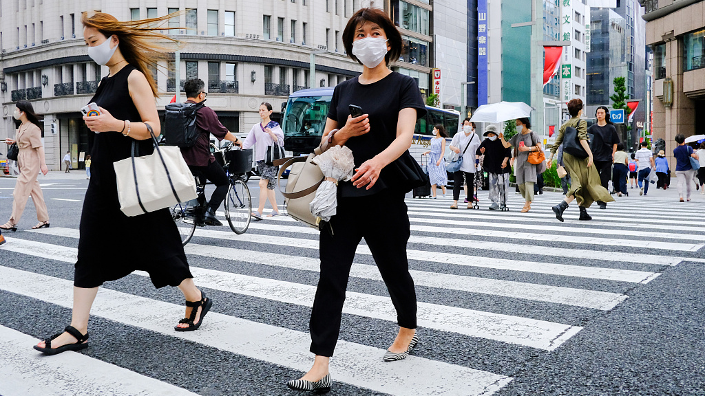 Pedestrians walk along the streets of Ginza shopping area in Tokyo, Japan, August 24, 2022. /CFP