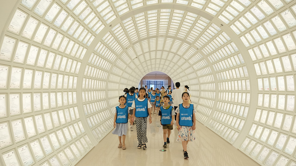 People visit the Fangtai Patent Tunnel with more than 8,000 national patent certificates, in Ningbo, east China's Zhejiang Province, August 18, 2022. /CFP