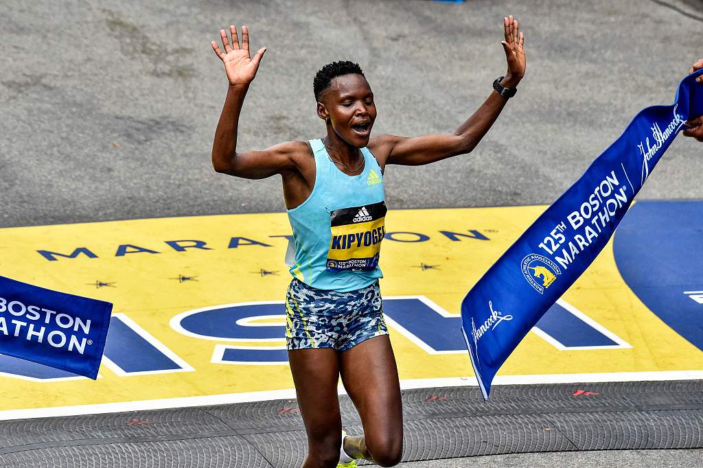 Diana Kipyogei of Kenya crosses the finish line to take first place in the professional women's division during the 125th Boston Marathon in Boston, U.S., October 11, 2021. /CFP