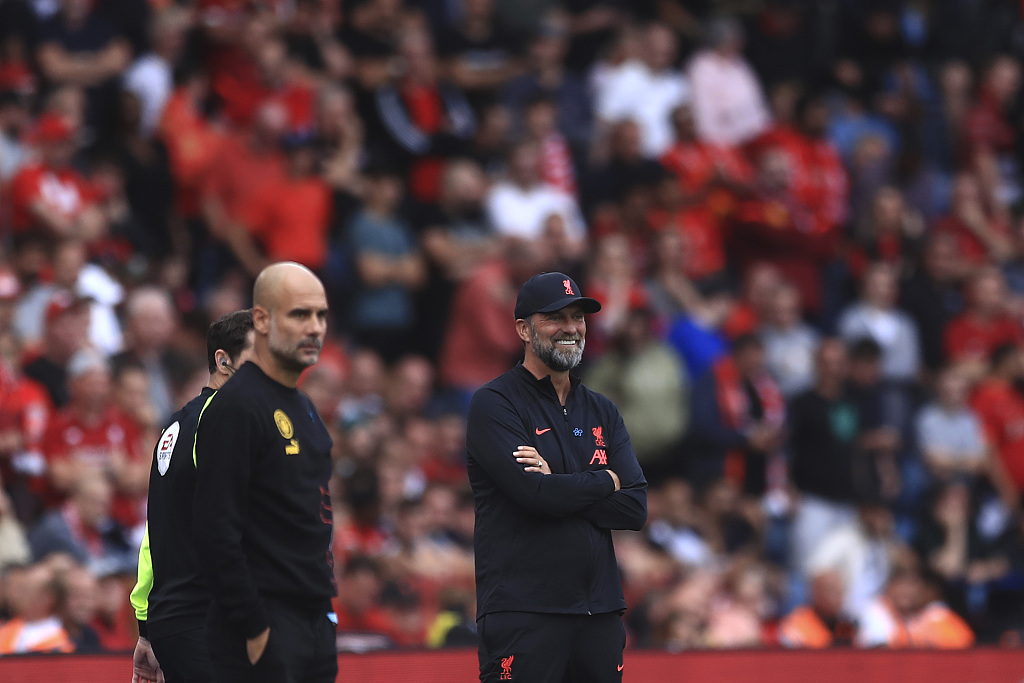 Pep Guardiola (L), manager of Manchester City, and Jurgen Klopp, manager of Liverpool, during the Community Field game at King Power Stadium in Leicester, England, July 30, 2022. /CFP