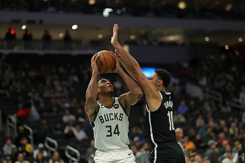 Ben Simmons (#10) of the Brooklyn Nets guards Giannis Antetokounmpo in the NBA pre-season game at Fiserv Forum in Milwaukee, Wisconsin, October 12, 2022. /CFP