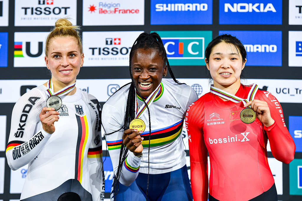 Silver medalist Emma Hinze (L) of Germany, gold medalist Taky Marie-Divine Kouame of France and bronze medalist Guo Yufang (R) of China celebrate on the podium after their women's 500m time trial event in Saint-Quentin-en-Yvelines, France, October 15, 2022. /CFP