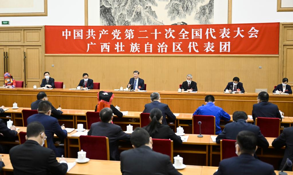 Xi Jinping joins a group discussion with delegates from south China's Guangxi Zhuang Autonomous Region who are attending the 20th National Congress of the Communist Party of China (CPC) in Beijing, October 17, 2022. /Xinhua