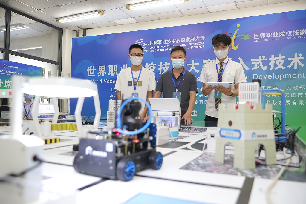 Participants test robots at the World Vocational College Skills Competition, north China's Tianjin Municipality, August 8, 2022. /CFP
