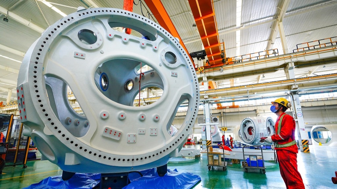 A staff working on a wind power equipment at a factory in northwest China's Xinjiang Uygur Autonomous Region, May 30, 2022. /CFP