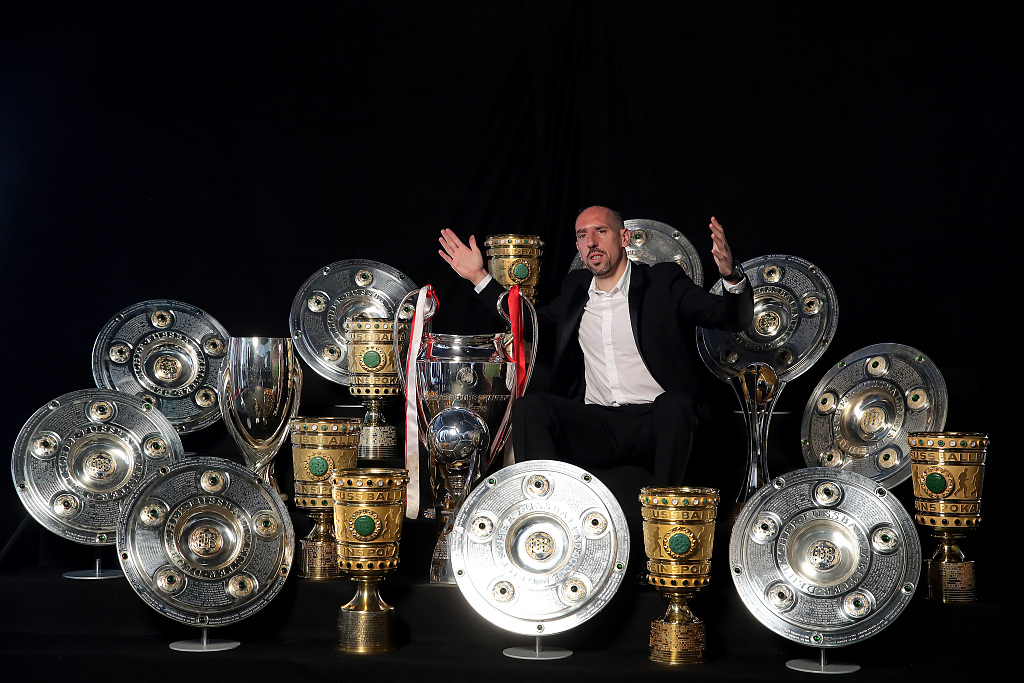 Franck Ribery poses for a photo with the championship trophies he has won in Bayern Munich at FCB Erlebniswelt in Munich, Germany, May 28, 2019. /CFP 