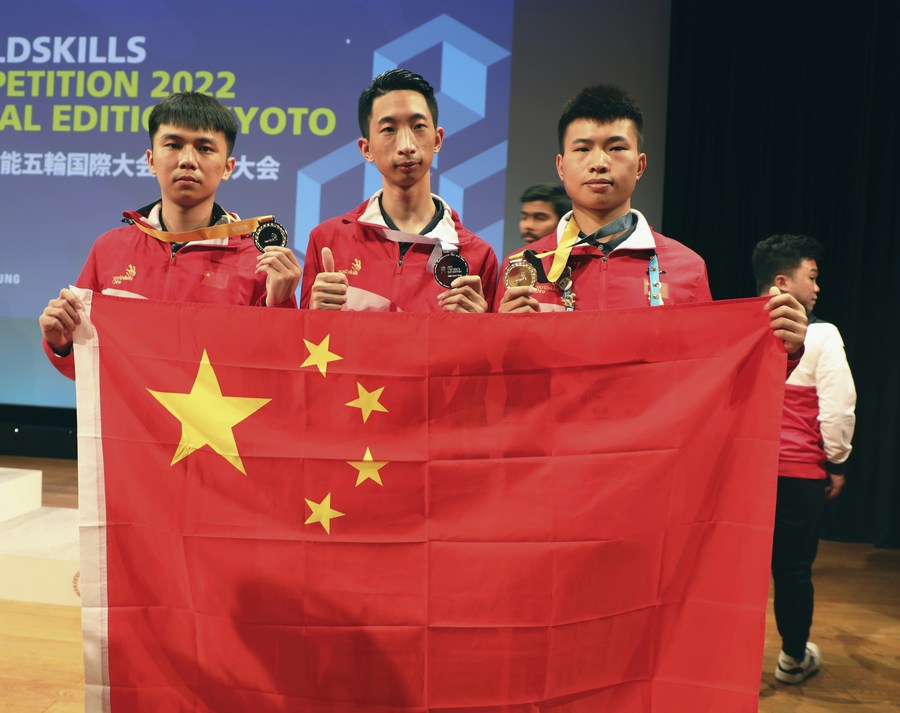 L to R: Chinese competitors Chen Zhiyong, Zhang Honghao and Li Xiaosong at the awarding ceremony of the WorldSkills Competition 2022 Special Edition in Kyoto, Japan, October 19, 2022. /Xinhua