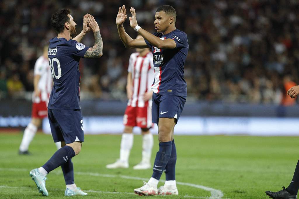 Kylian Mbappe (R) of PSG is congratulated by teammate Lionel Messi after scoring a goal during the Ligue 1 match between AC Ajaccio and PSG at the Francois Coty Stadium in Ajaccio, France, October 21, 2022. /CFP