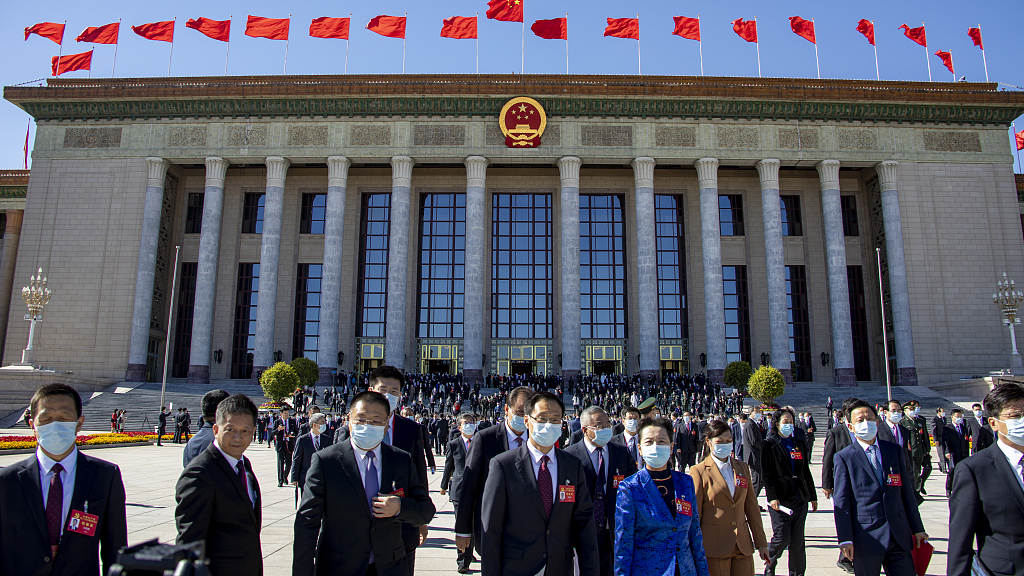 Delegates leave after the closing session of the 20th National Congress of the Communist Party of China at the Great Hall of the People in Beijing, China, October 22, 2022. /CFP