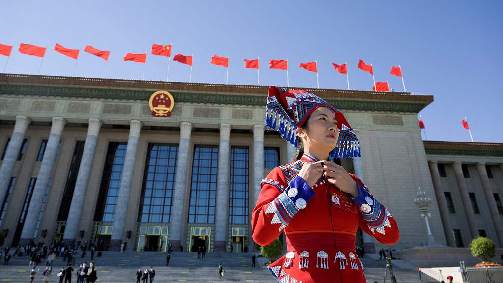 A delegate leaves after the closing ceremony of the 20th CPC National Congress at the Great Hall of the People in Beijing, China, October 22, 2022. /CFP