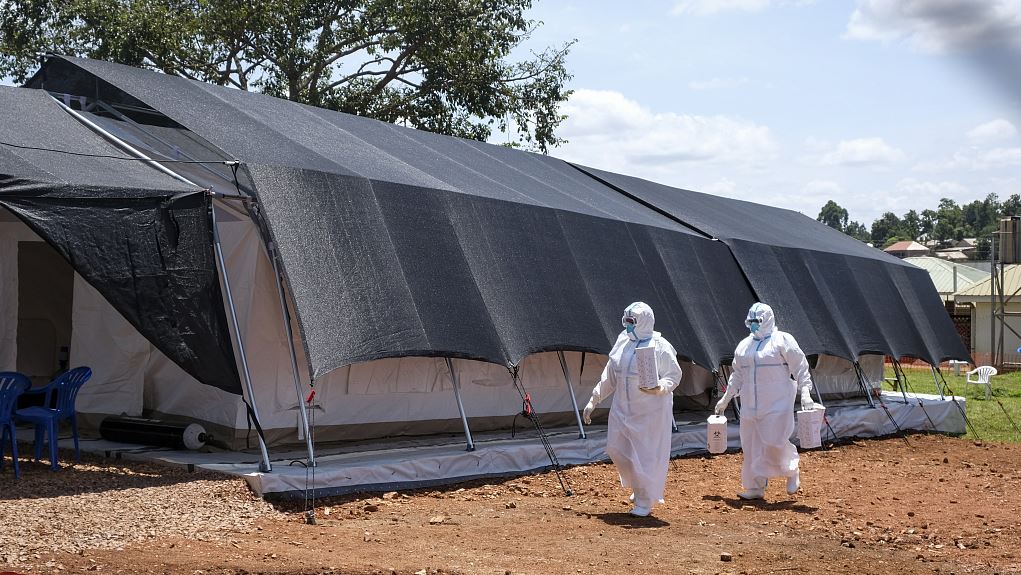 Doctors walk inside the Ebola isolation section of Mubende Regional Referral Hospital, in Mubende, Uganda, September 29, 2022. /CFP