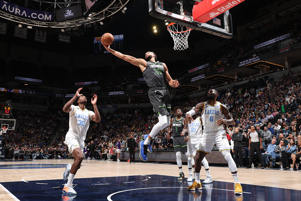 Rudy Gobert (C) of the Minnesota Timberwolves grabs a rebound in the game against the Los Angeles Lakers at Target Center in Minneapolis, Minnesota, October 28, 2022. /CFP
