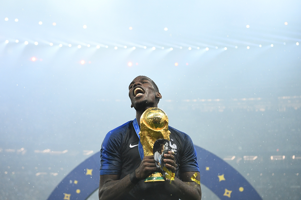 Paul Pogba of France celebrates with the FIFA World Cup championship trophy after the 4-2 win over Croatia in the final game at the Luzhniki Stadium in Moscow, Russia, July 15, 2018. /CFP