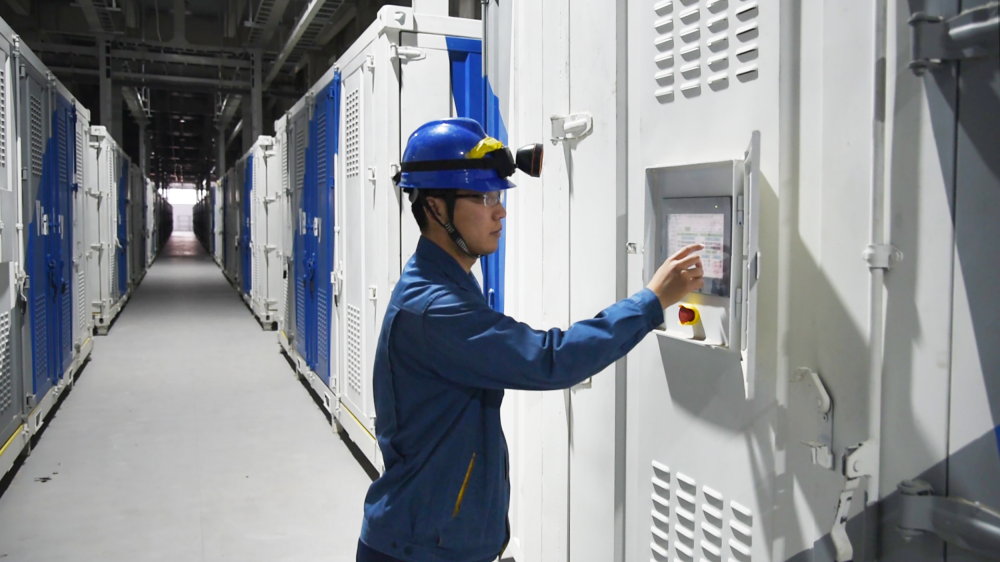 A technician operates the battery container at the Dalian Institute of Chemical Physics. /DICP
