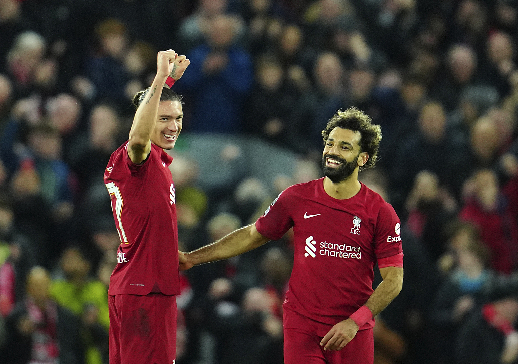 Liverpool's Darwin Nunez (L) and Mohamed Salah celebrate their 2-0 win over Napoli at the end of their Champions League match at Anfield stadium in Liverpool, England, November 1, 2022. /CFP