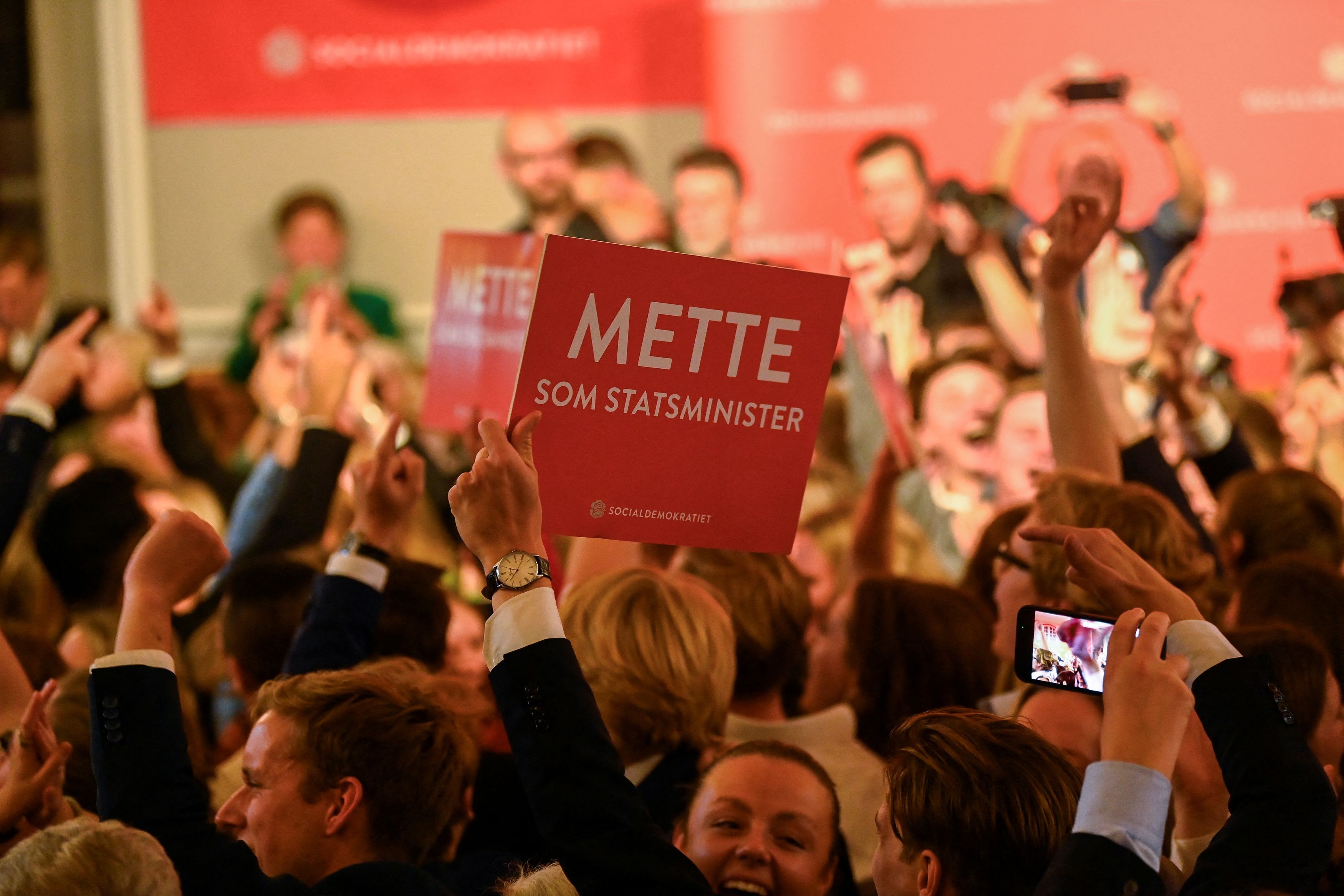 Supporters of Denmark's prime minister and head of the Social Democratic Party, Mette Frederiksen, during a party for the general election, Copenhagen, Denmark, November 2, 2022. /Reuters