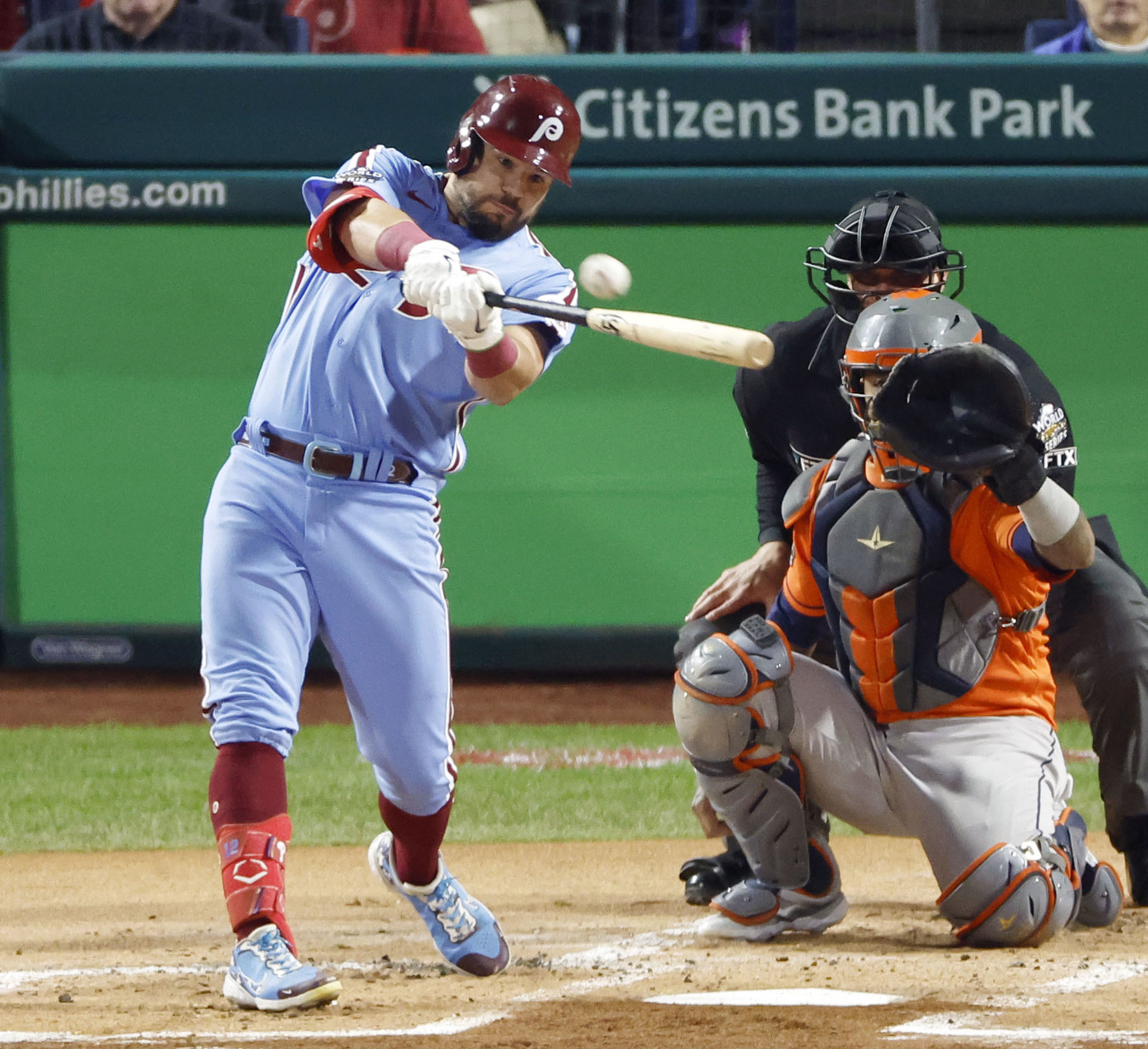 Left fielder Kyle Schwarber (L) of the Philadelphia Phillies hits a home run during the first inning in Game 5 of the MLB World Series against the Houston Astros at Citizens Bank Park in Philadelphia, Pennsylvania, November 3, 2022. /CFP
