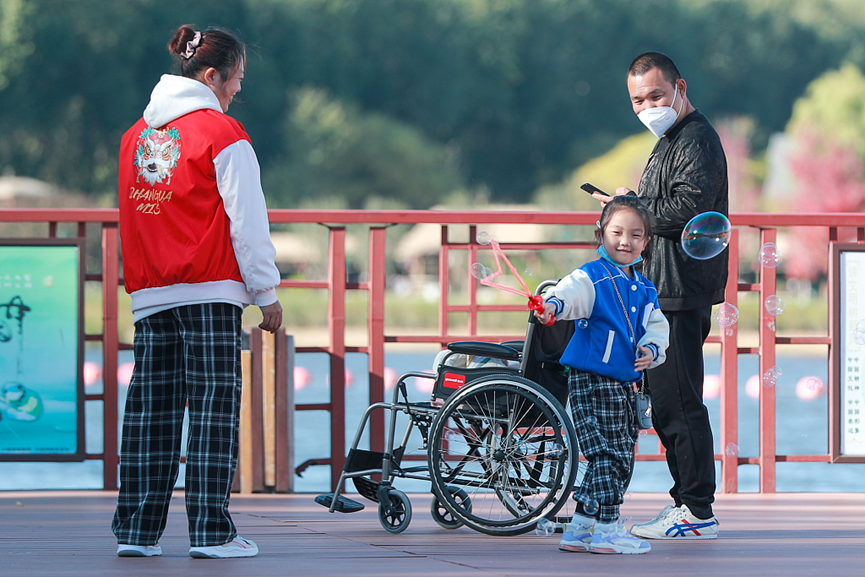 People spend their weekend at Grand Canal Forest Park, in Tongzhou District, Beijing, China, October 22, 2022. /CFP